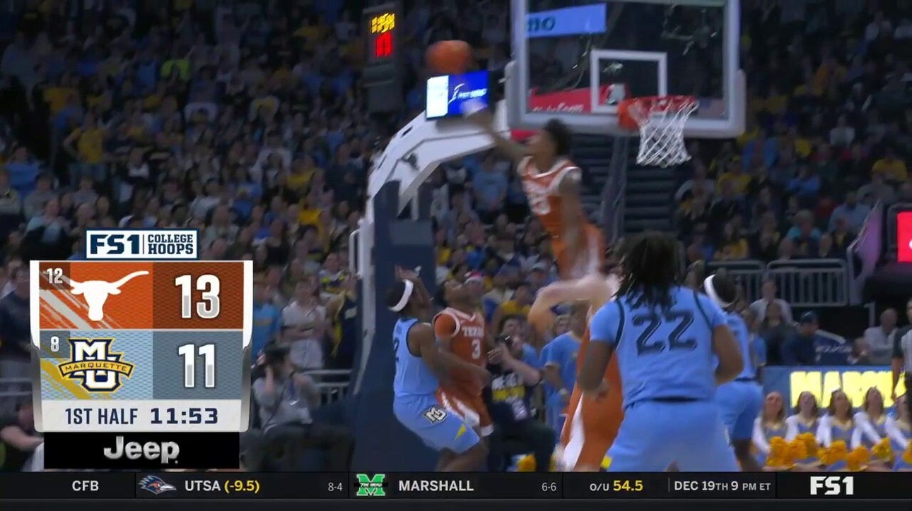 Texas' Dillon Mitchell delivers a monstrous block against Marquette's Chase Ross