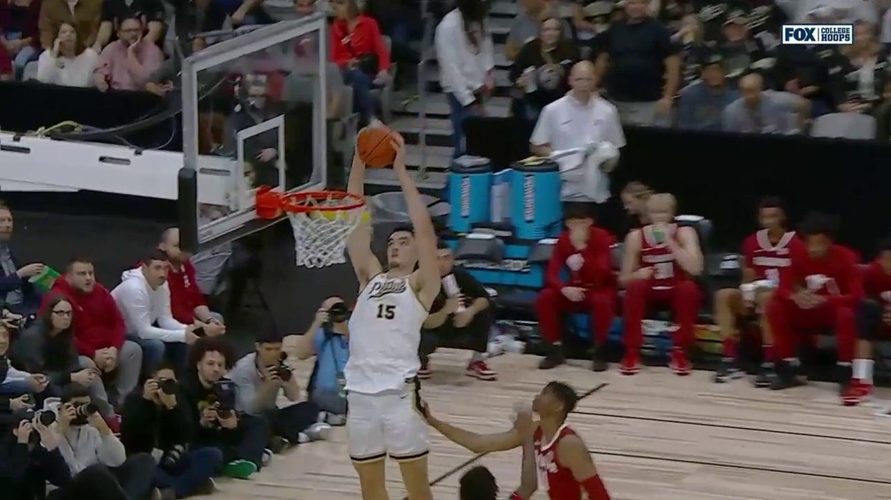 Purdue's Zach Edey throws down a two-handed slam on the alley-oop from Fletcher Loyer