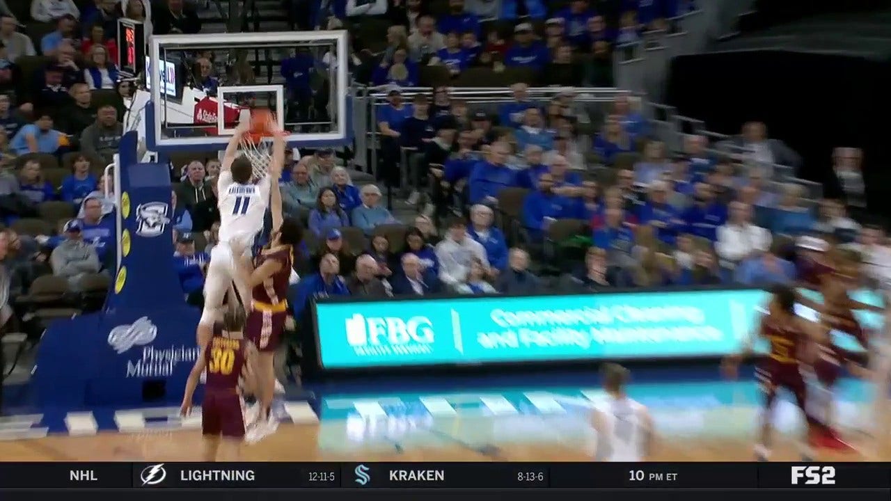  Ryan Kalkbrenner finishes a strong and-1 alley-oop to extend Creighton's lead over Central Michigan