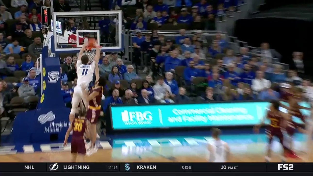  Ryan Kalkbrenner finishes a strong and-1 alley-oop to extend Creighton's lead over Central Michigan