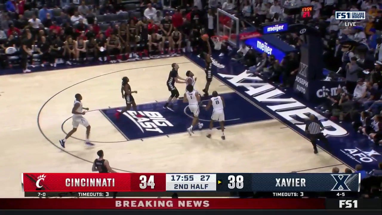 John Newman III slams a two-handed jam to trim Cincinnati's deficit vs. Xavier