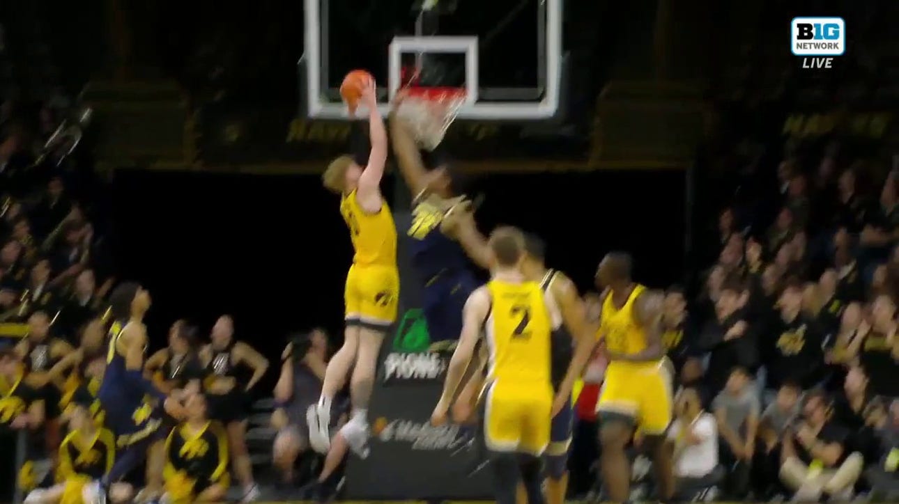 Iowa's Ladji Dembele finds Even Brauns in the post for a two-handed slam to trim Michigan's lead