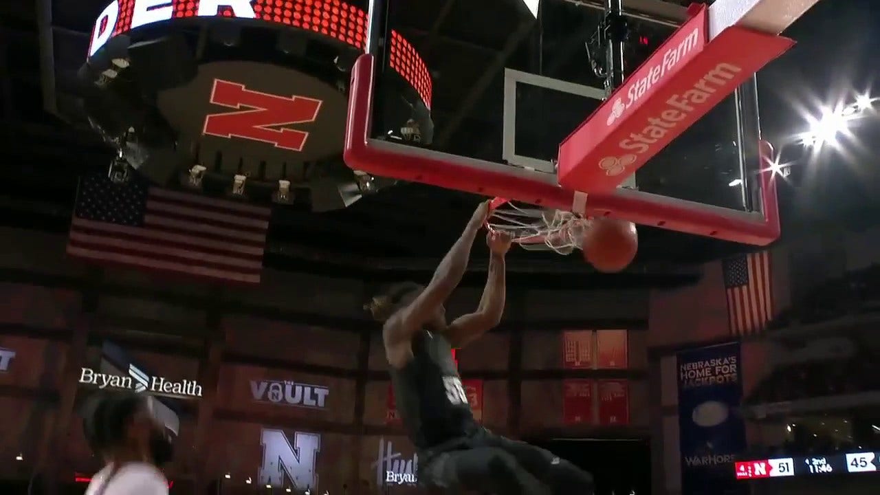 Michigan State's Tyson Walker lobs it to Coen Carr for a monstrous two-handed slam to shrink Nebraska's lead