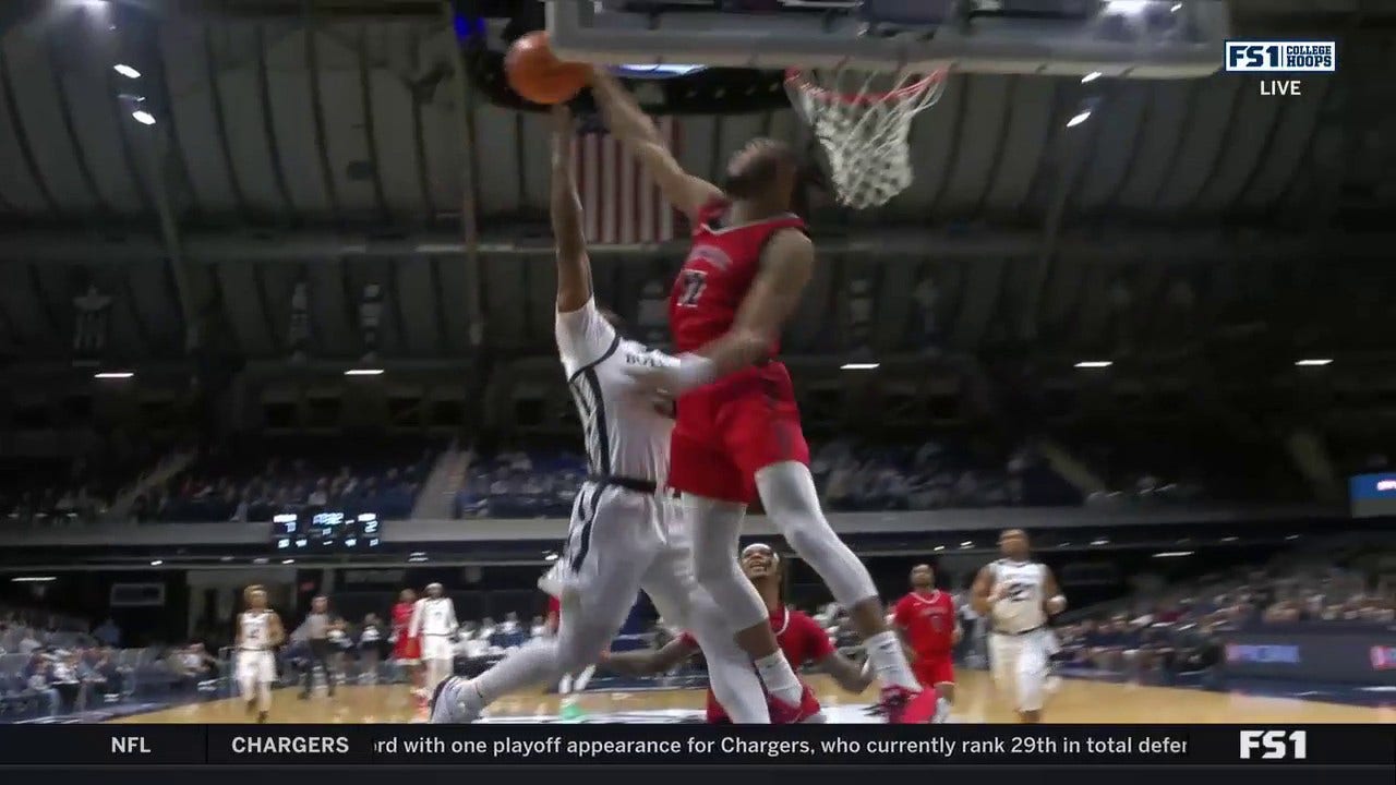 Saginaw Valley's Toodles Seal delivers a monstrous block against Butler's Posh Alexander