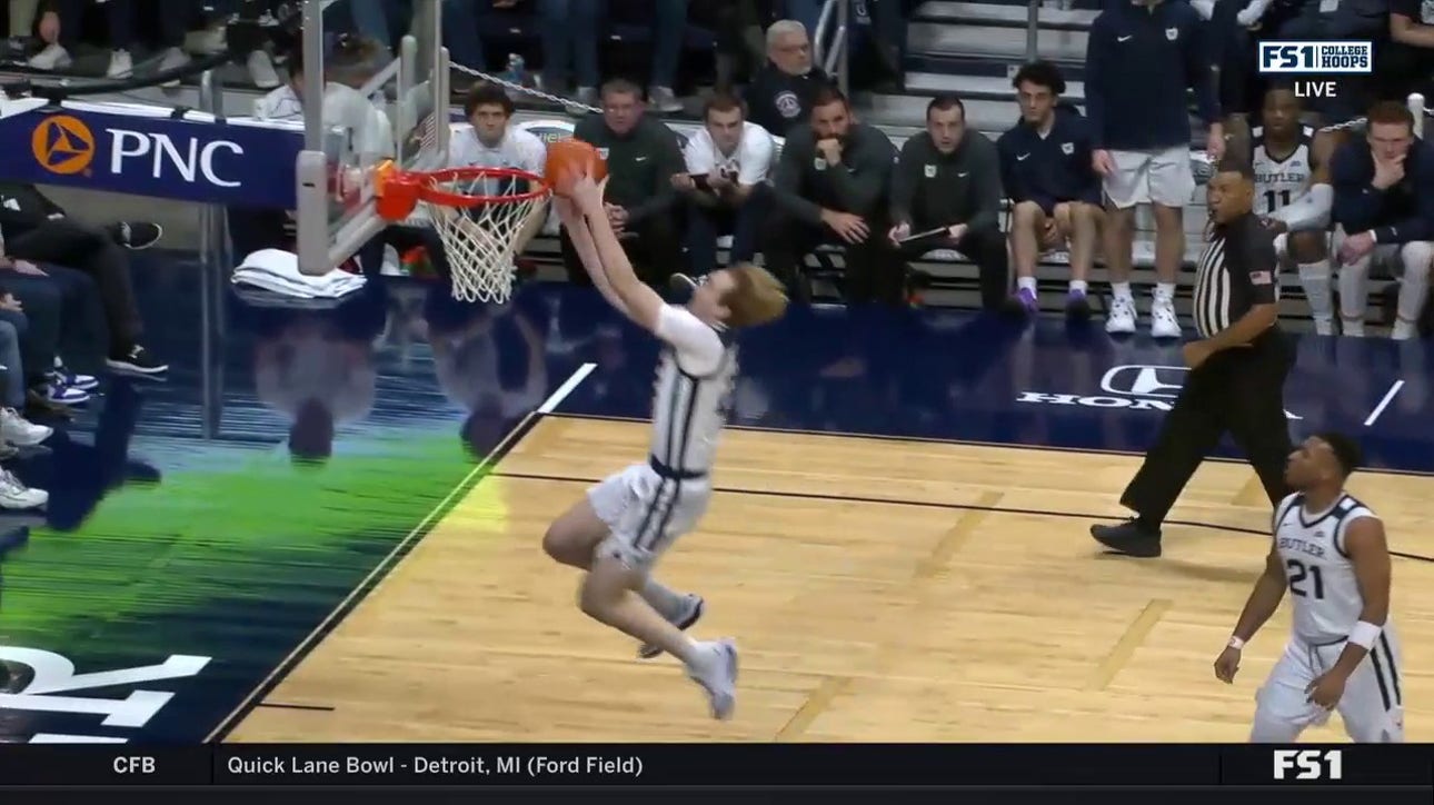 Butler's Pierre Brooks tosses it off the backboard to Connor Turnbull for the alley-oop