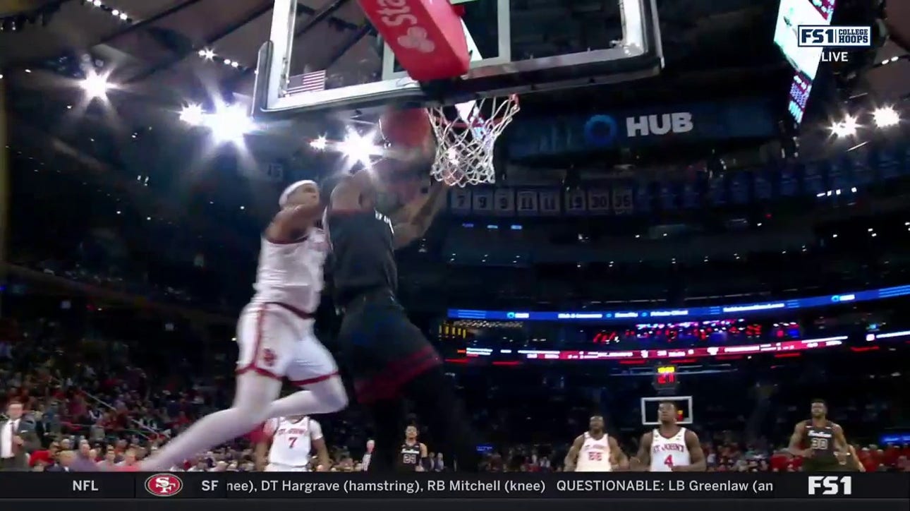 St. John's Joel Soriano makes a one-handed block to keep the lead against Fordham