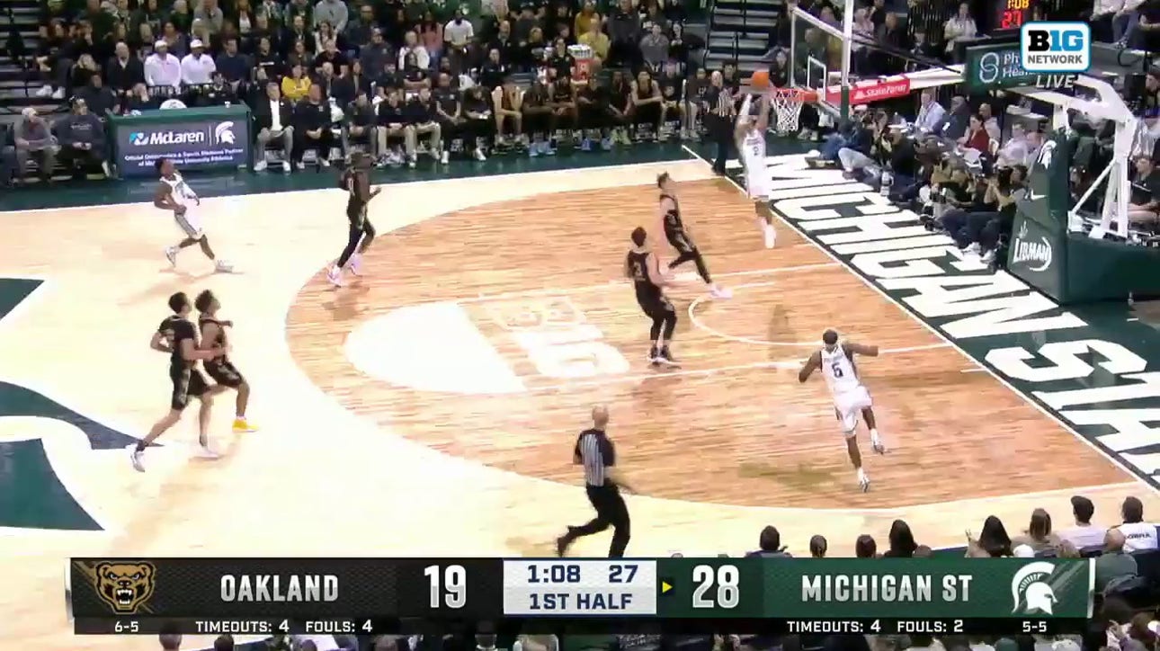 Jaden Akins throws down a dunk in transition, extending Michigan State's lead vs. Oakland