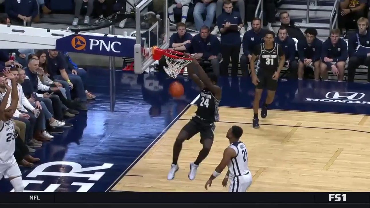 Georgetown's Supreme Cook snags the offensive rebound and slams it with two hands to shrink Butler's lead
