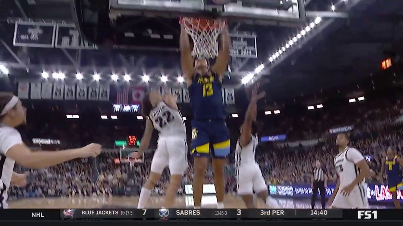 Marquette's Oso Ighodaro slams a strong two-handed dunk to trim Providence's lead