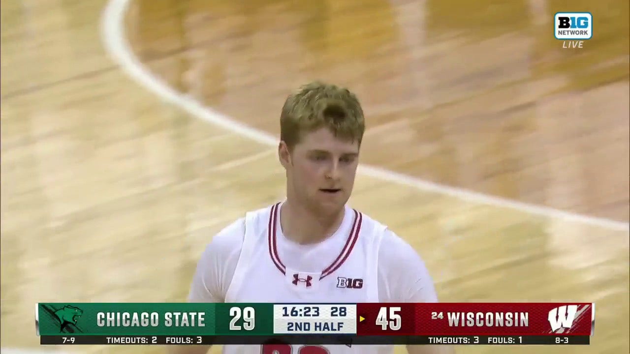 Wisconsin's Steven Crowl throws down a powerful two-handed dunk against Chicago State