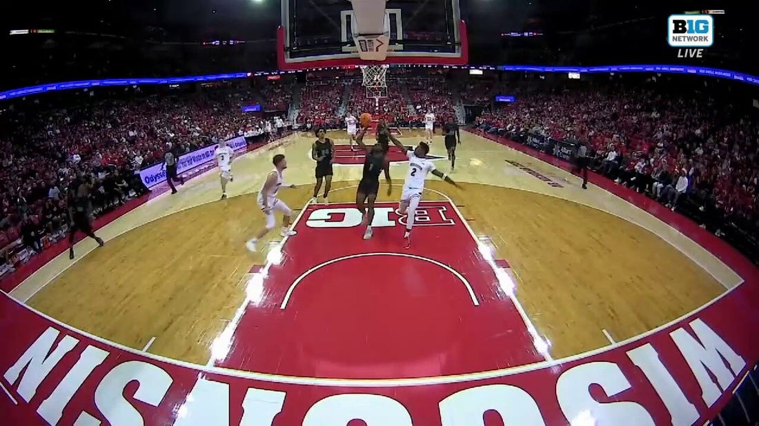 Chicago State's Cameron Jernigan flies up the middle for a wicked one-handed dunk against Wisconsin