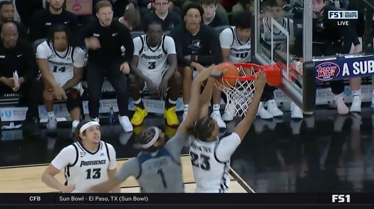Providence's Bryce Hopkins cuts baseline for a powerful jam against Butler