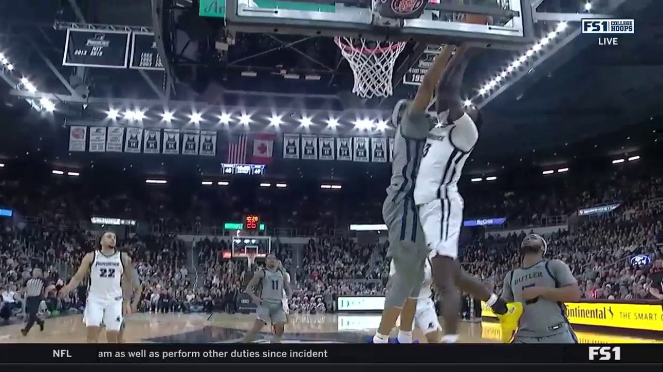 Providence's Garwey Dual makes a tough basket plus contact against Butler to extend the lead