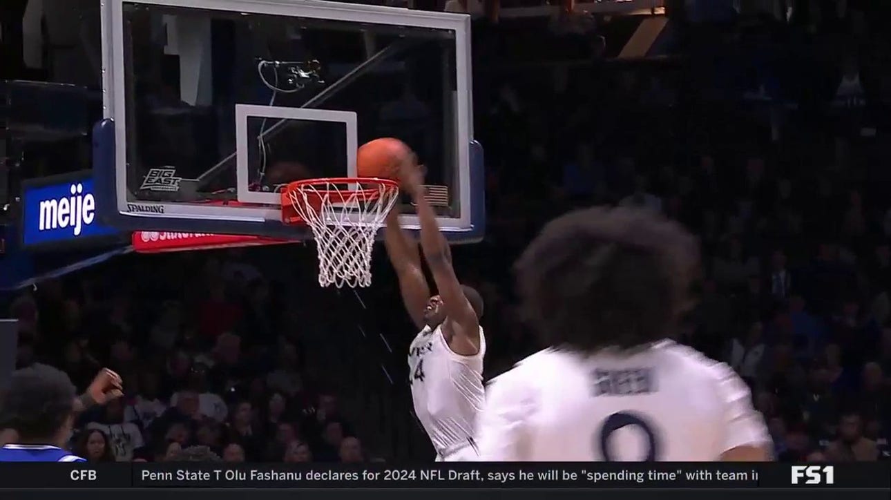 Xavier's Abou Ousmane throws down the alley-oop dunk to extend the lead against Seton Hall