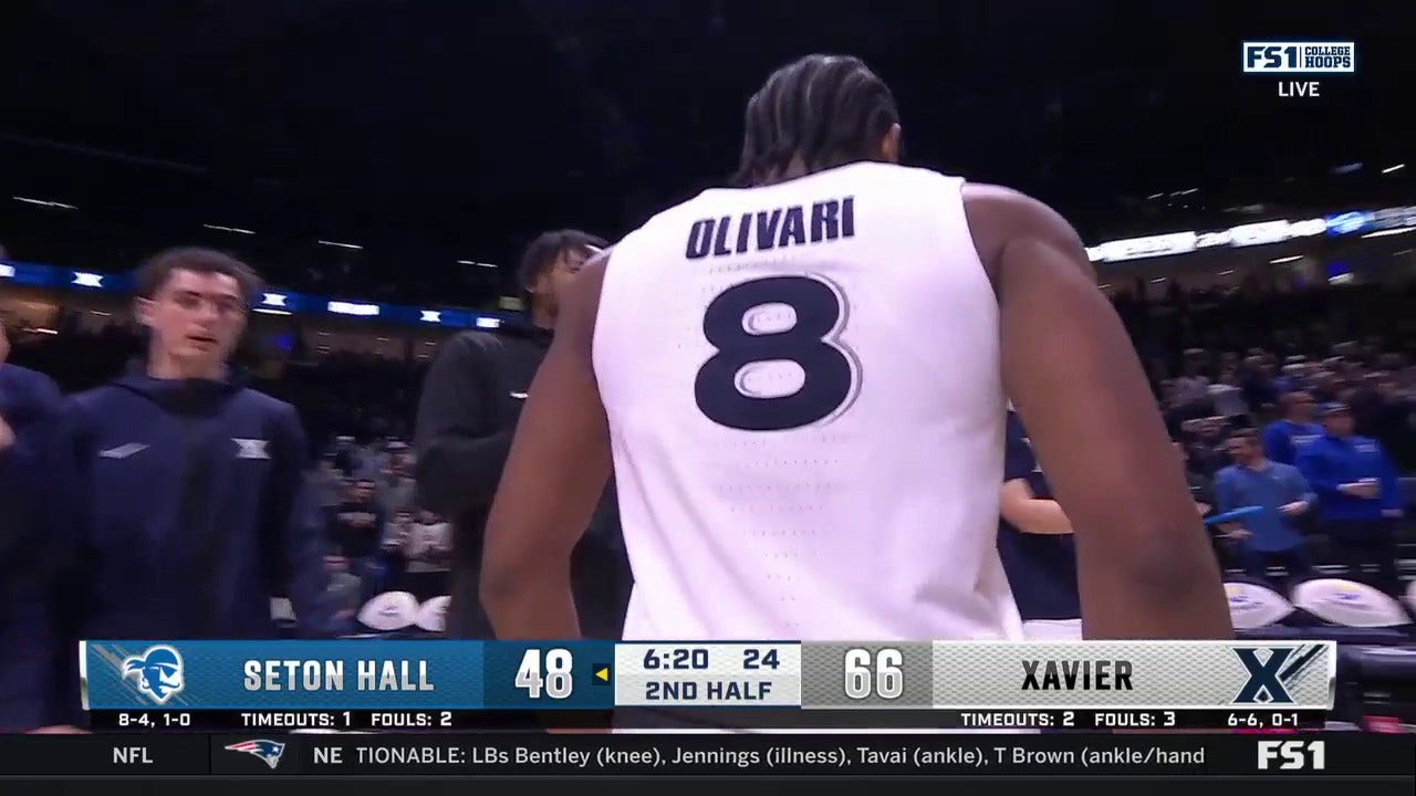 Quincy Olivari nails a 3-pointer to seal Xavier's dominant 74-54 victory over Seton Hall