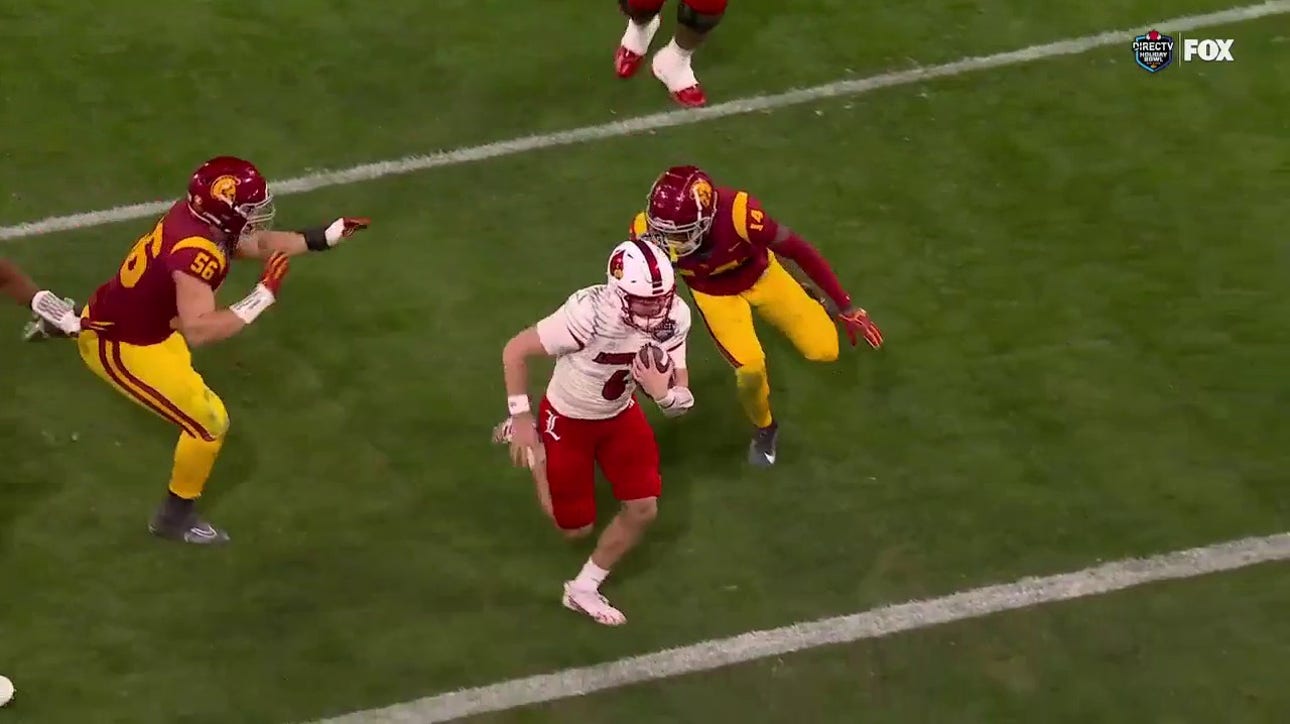 Louisville's Evan Conley sprints past USC's defense on a 9-yard rushing TD to trim deficit