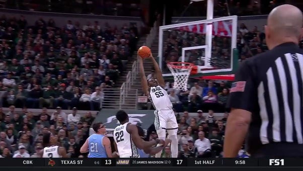 Coen Carr rises for the strong two-handed alley-oop to extend Michigan State's lead over Indiana State