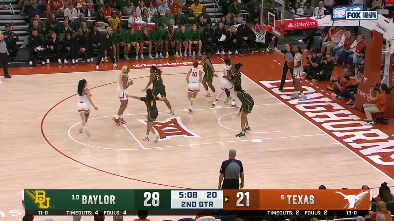 Texas' Aaliyah Moore pulls off an and-1 layup to cut into Baylor's lead