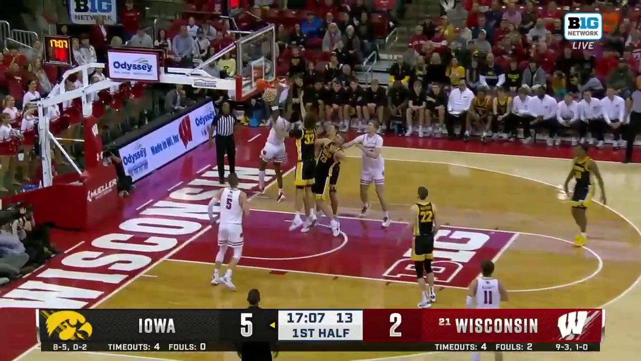 Wisconsin's AJ Storr throws down a dunk in traffic vs. Iowa