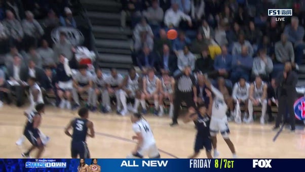 Jordan Longino drills an and-1 3-pointer to extend Villanova's lead over Xavier