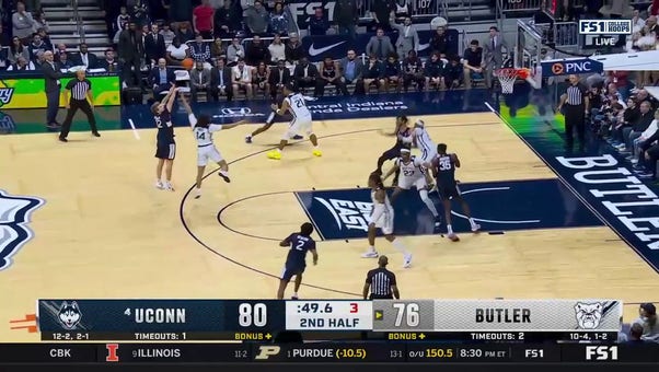 UConn's Cam Spencer makes a wild 3-pointer to help secure the the 88-81 win over Butler