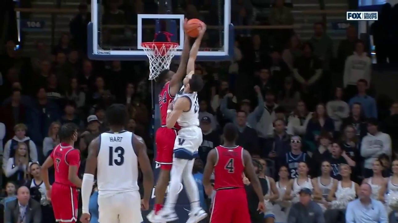 Zuby Ejiofor FEROCIOUSLY swats a dunk attempt to protect St John's lead over Villanova