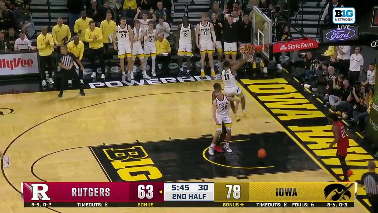 Tony Perkins comes up with the steal and throws down a one-handed flush to extend Iowa's lead over Rutgers