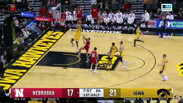 Owen Freeman flushes the alley-oop on the fast break to extend Iowa's lead over Nebraska