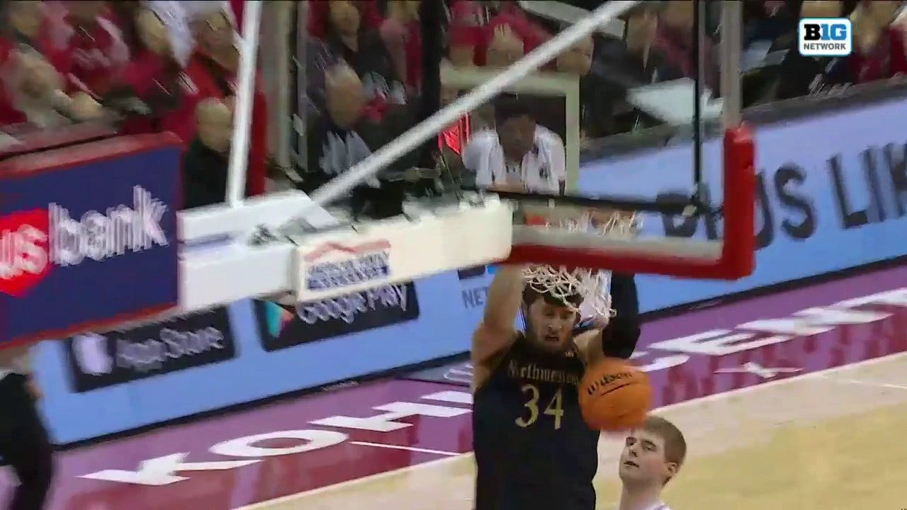 Northwestern's Matthew Nicholson throws down a thunderous two-handed jam off the pass from Boo Buie