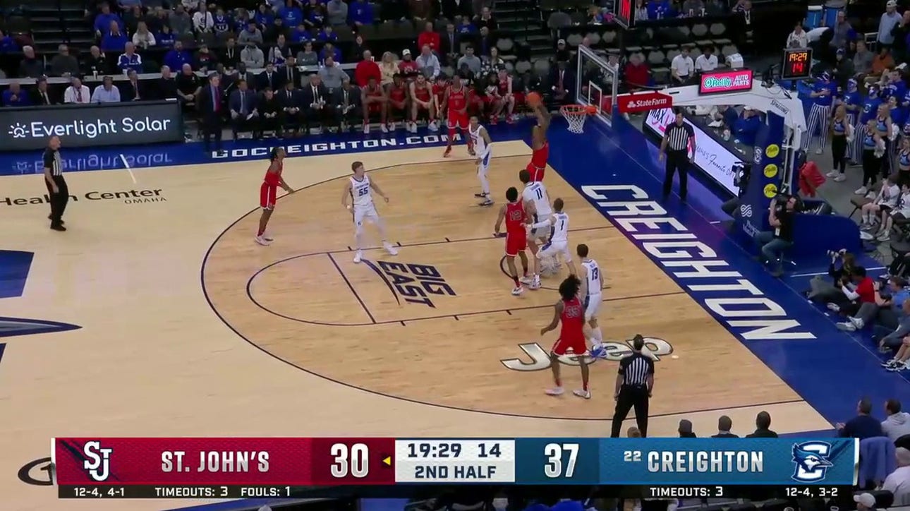 St. John's Joel Soriano rises for the strong two-handed dunk to shrink Creighton's lead