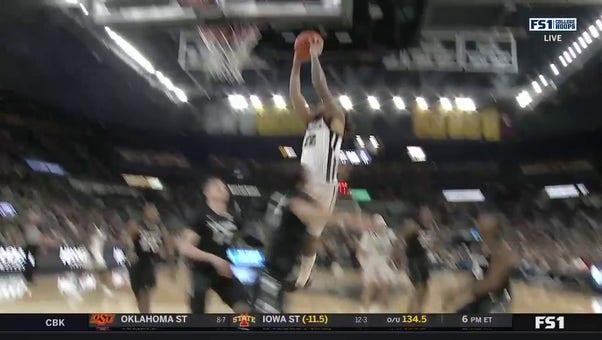 Providence's Devin Carter throws down the two-handed dunk to increase the lead over Xavier