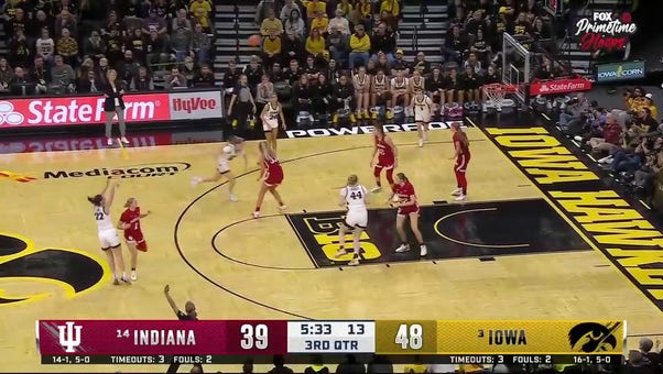 Caitlin Clark sinks a 3-pointer as Iowa extends its lead over Indiana