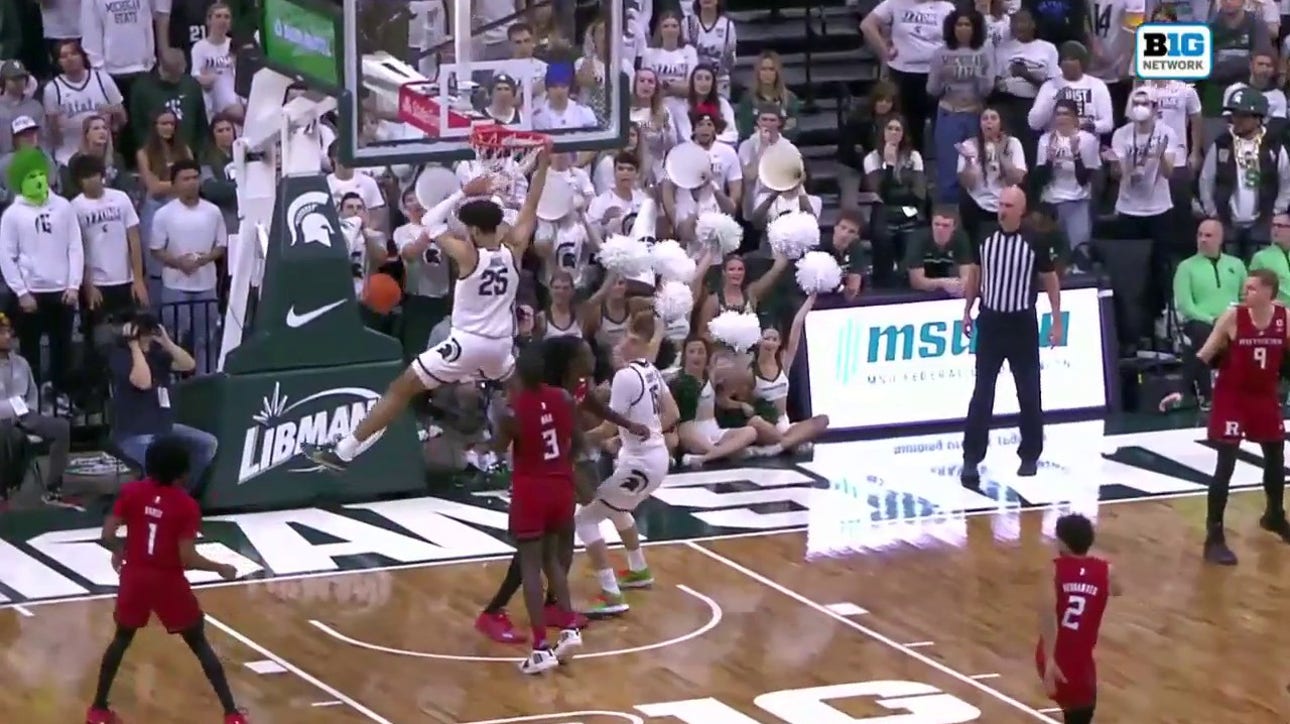 Malik Hall throws down the two-handed dunk to help Michigan State increase the lead over Rutgers