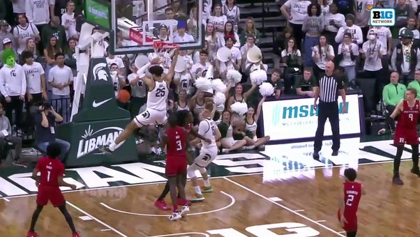 Malik Hall throws down the two-handed dunk to help Michigan State increase the lead over Rutgers