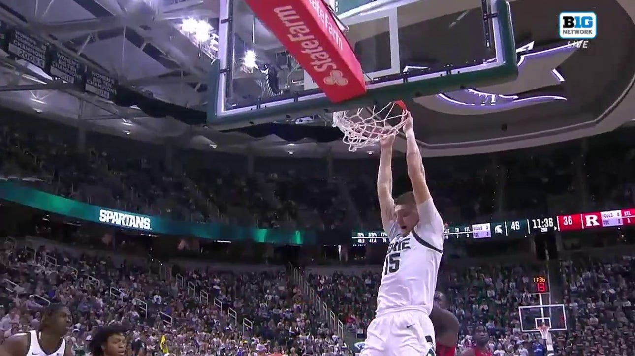 Carson Cooper hammers a two-handed jam to extend Michigan State's lead over Rutgers