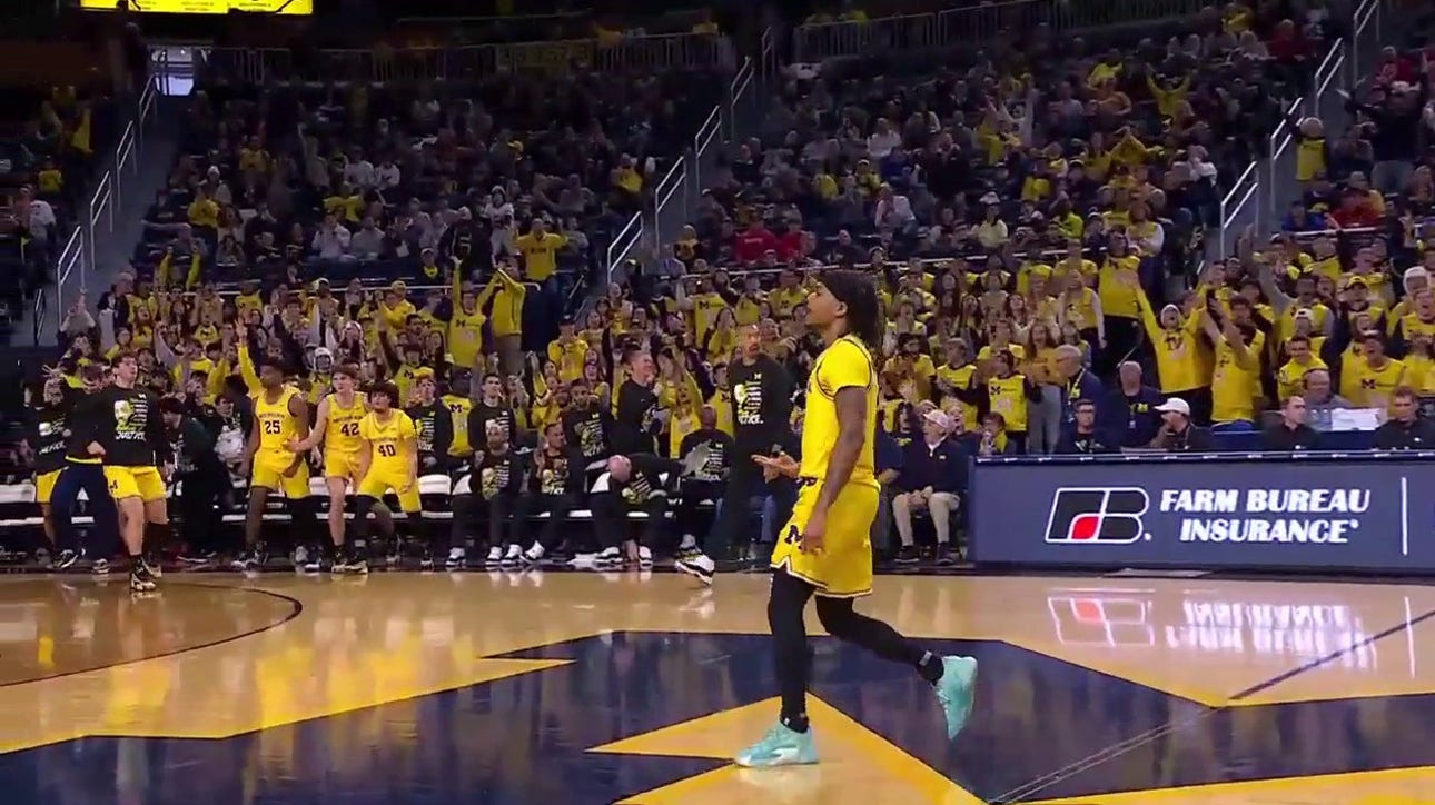 Michigan's Dug McDaniel sinks a buzzer-beating 3-pointer to end the first half vs. Ohio State