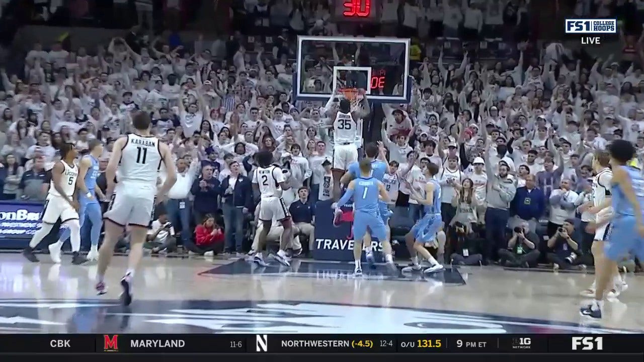 UConn's Samson Johnson gets up for a putback jam early vs. Creighton