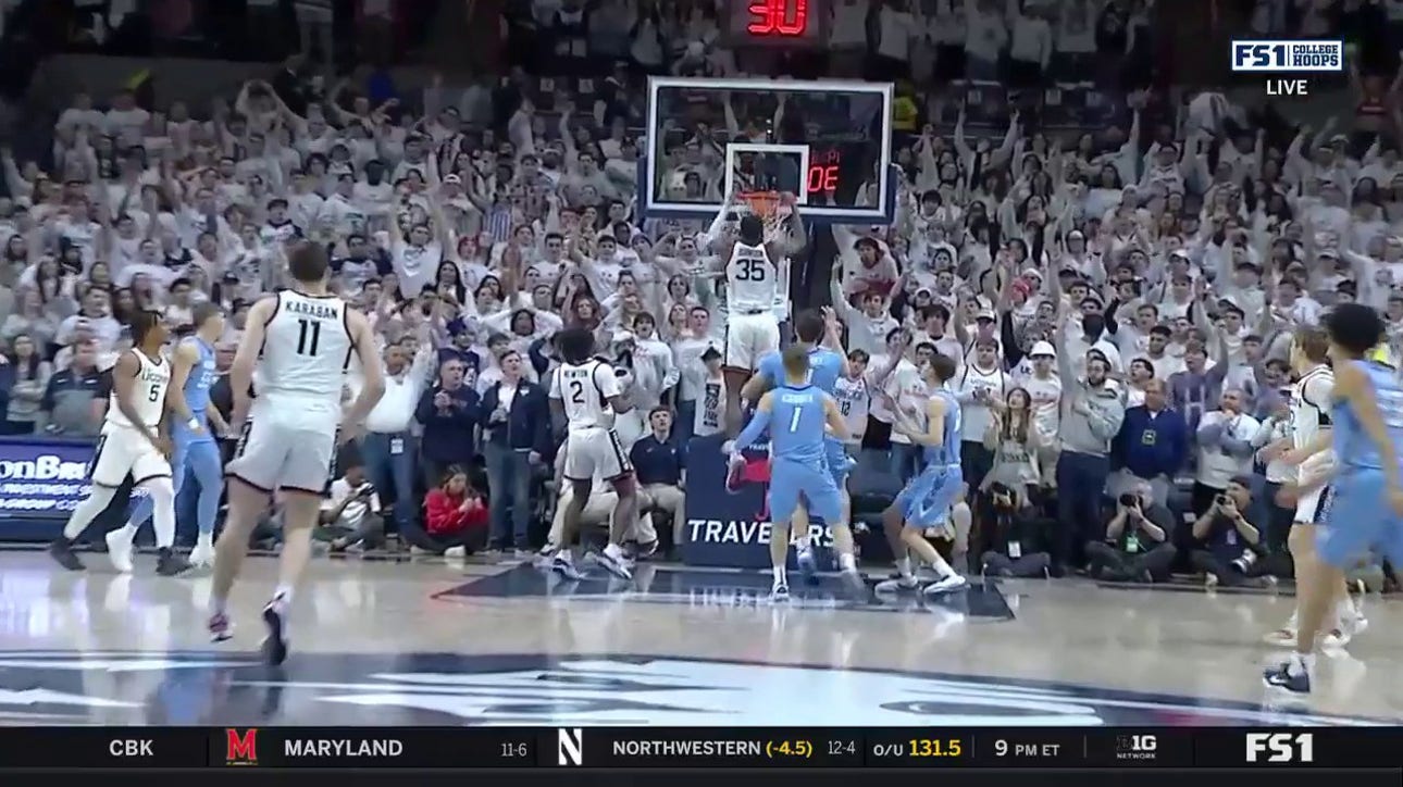 UConn's Samson Johnson gets up for a putback jam early vs. Creighton