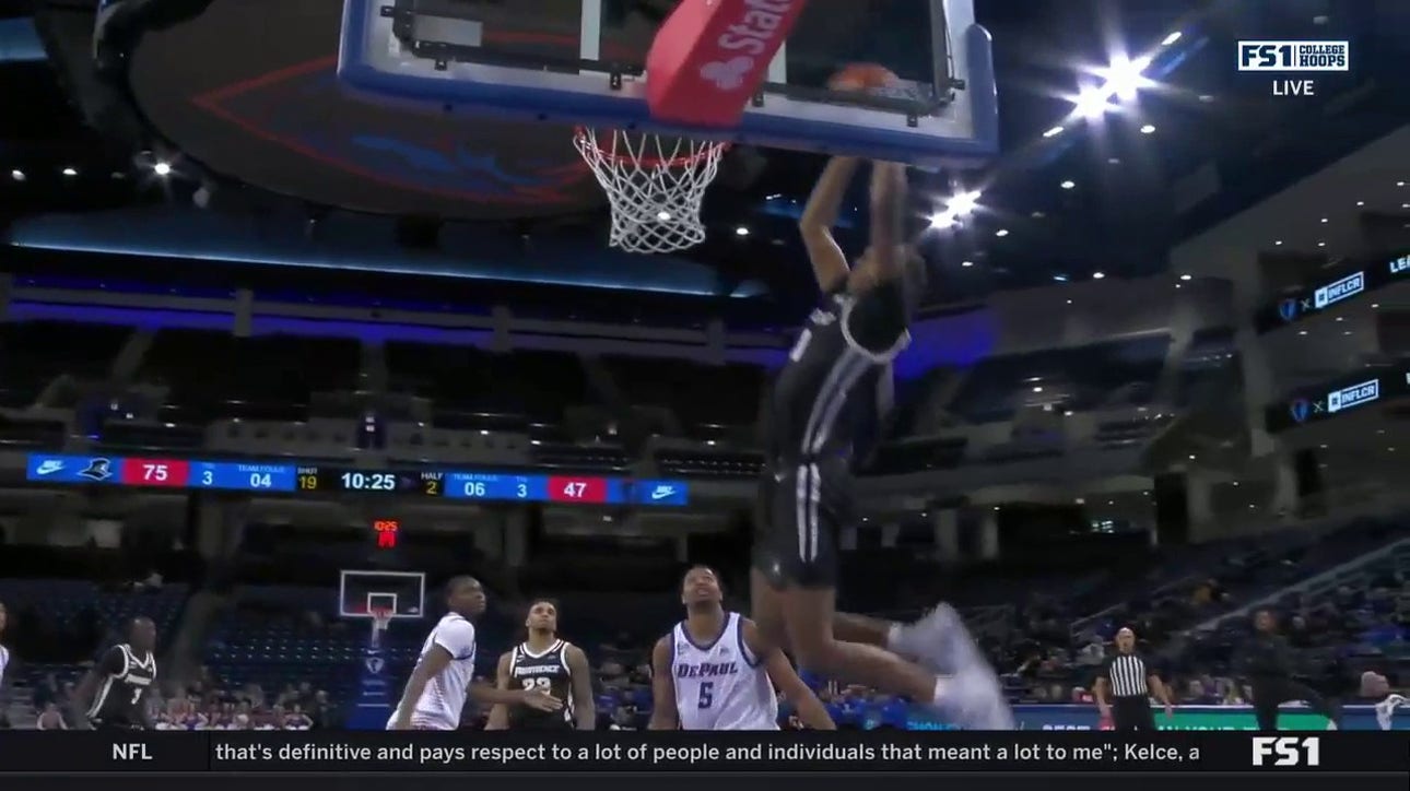Rafael Castro rises for a two-handed alley-oop to extend Providence's lead over DePaul