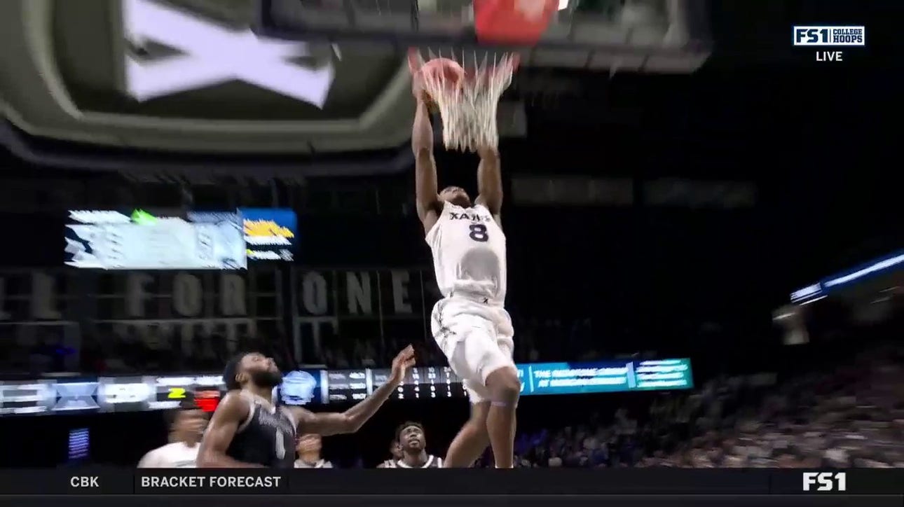 Xavier's Quincy Olivari throws down the two-handed jam to help close gap vs. Georgetown