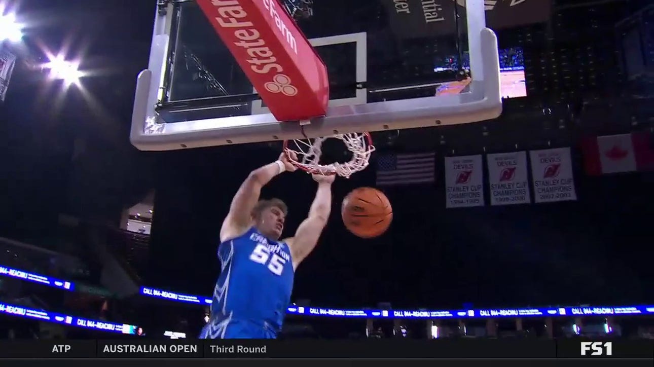 Creighton's Baylor Scheierman finishes the fast-break dunk to extend the lead over Seton Hall