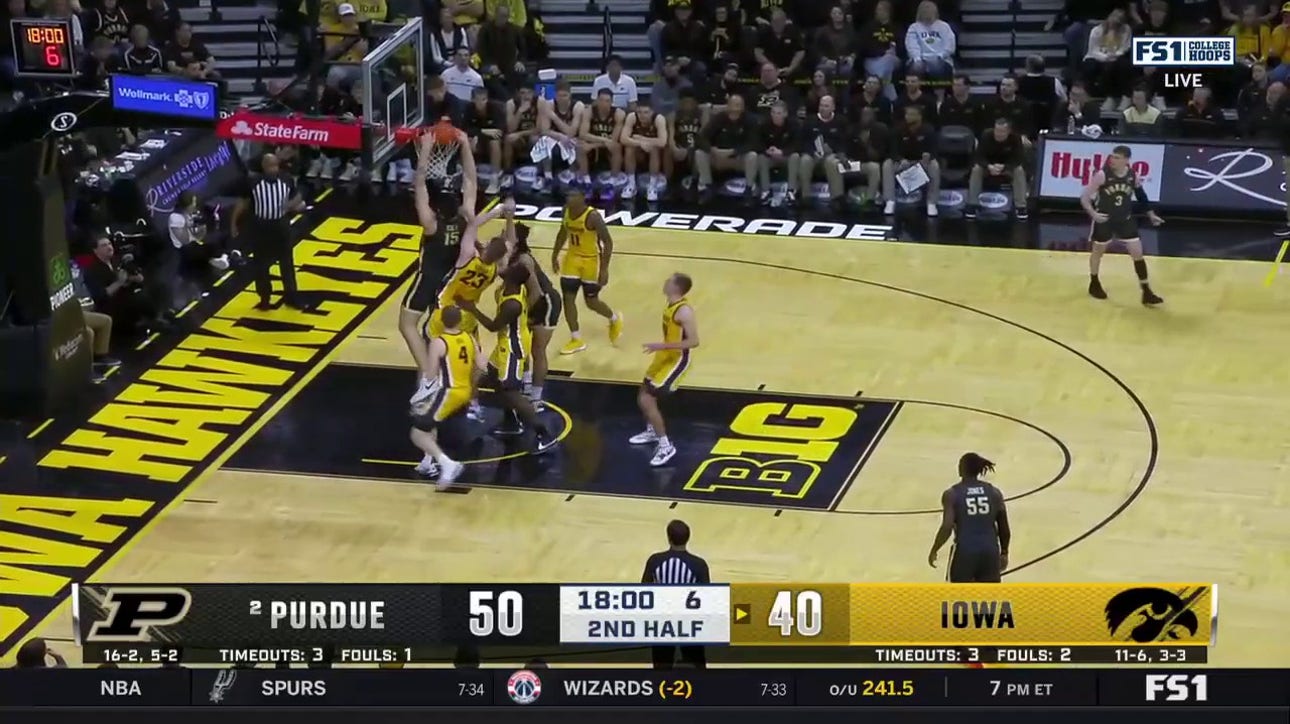 Purdue's Zach Edey bullies his way past Iowa's defense for a nasty jam