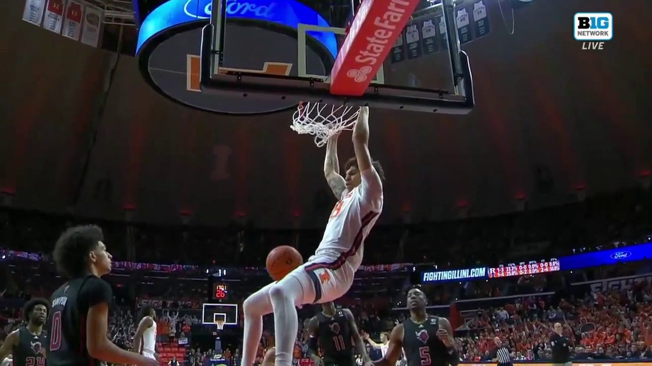 Illinois' Coleman Hawkins makes the high-flying alley-oop dunk to increase the lead over Rutgers