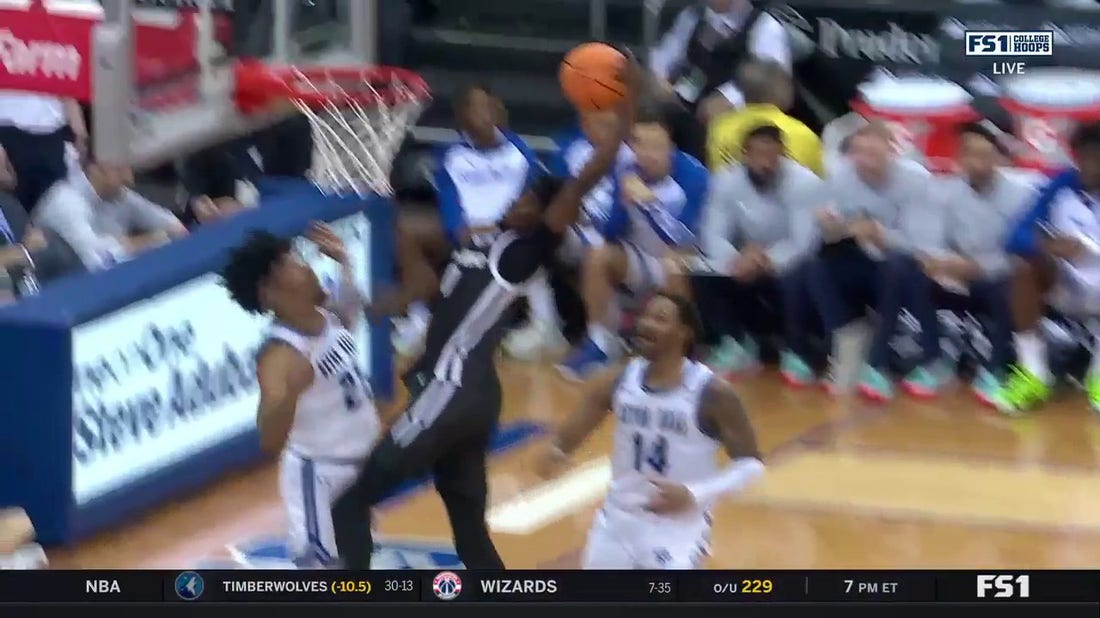 Providence's Ticket Gaines goes baseline for the one-handed poster over Seton Hall