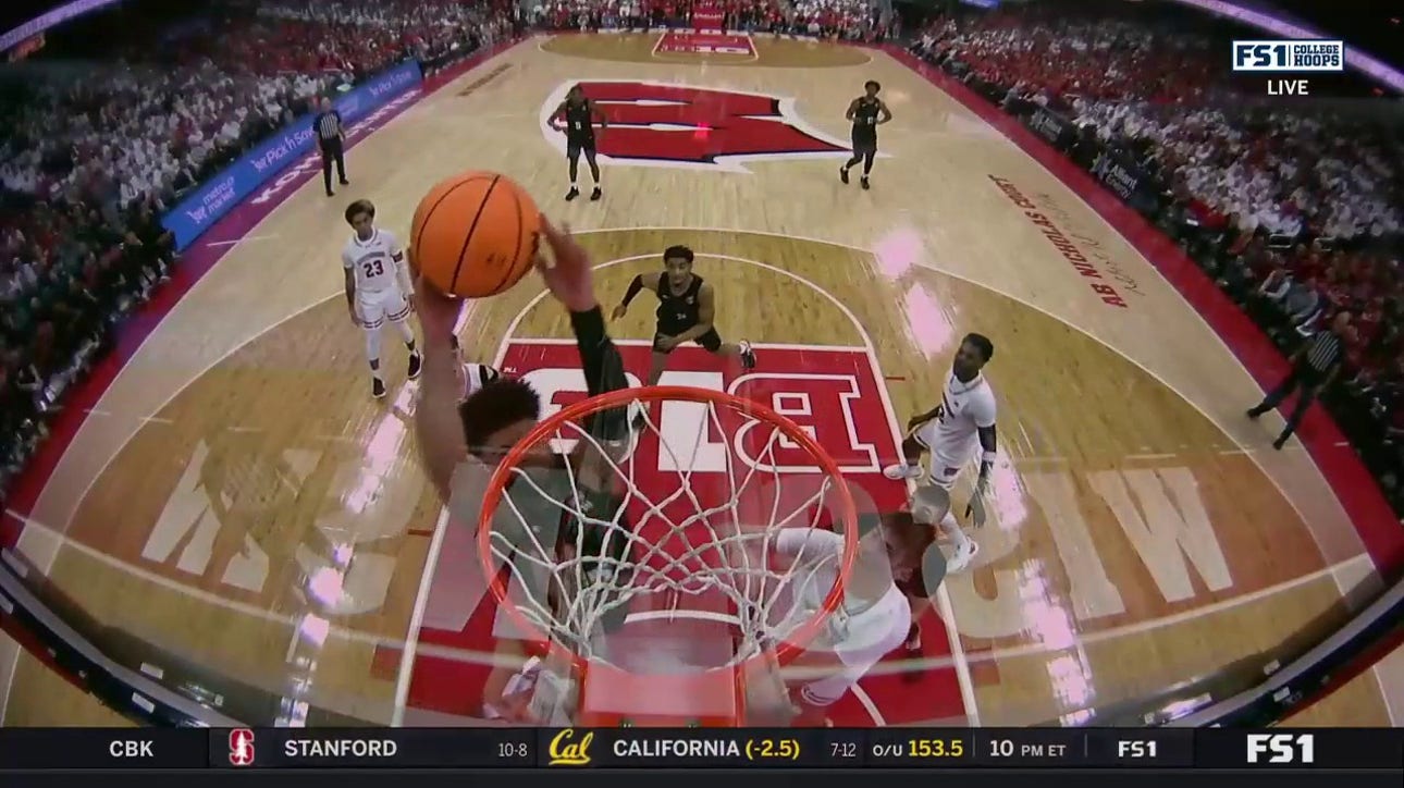 Michigan State's Malik Hall grabs the rebound and delivers a powerful two-handed jam