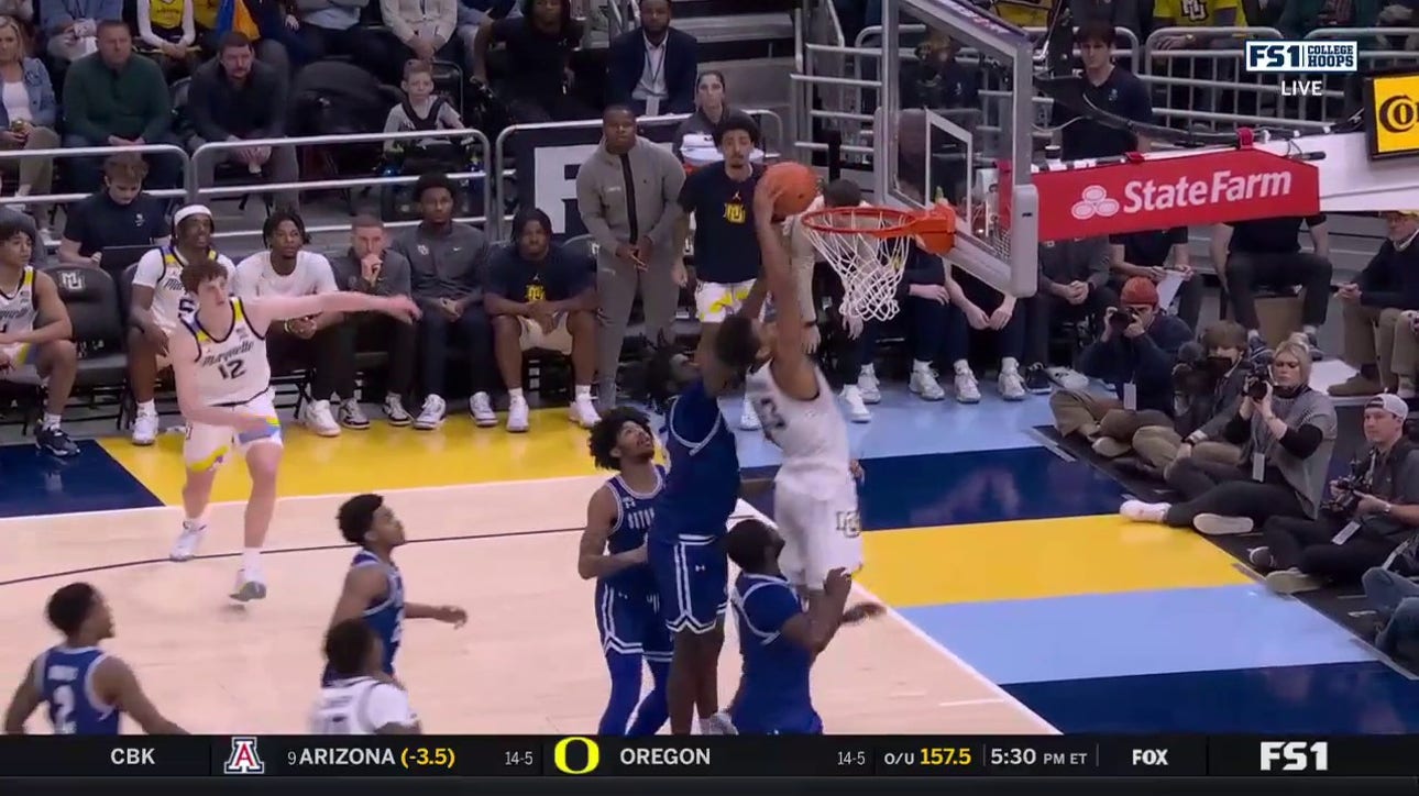 Marquette's Oso Ighodaro makes the one-handed put back dunk to increase lead over Seton Hall