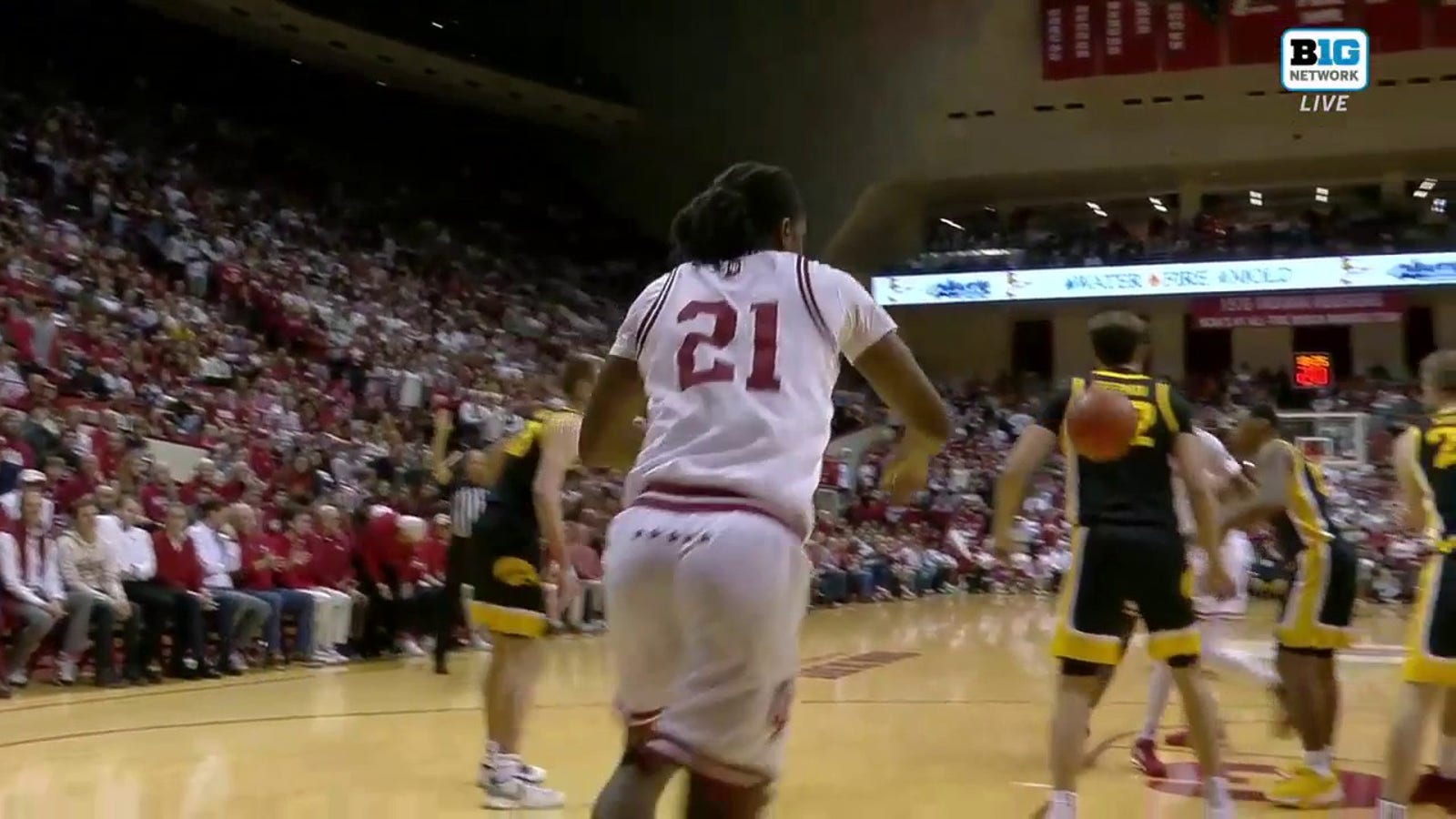Indiana's Mackenzie Mgbako throws an inbounds pass off an Iowa player's back, picks it up and scores