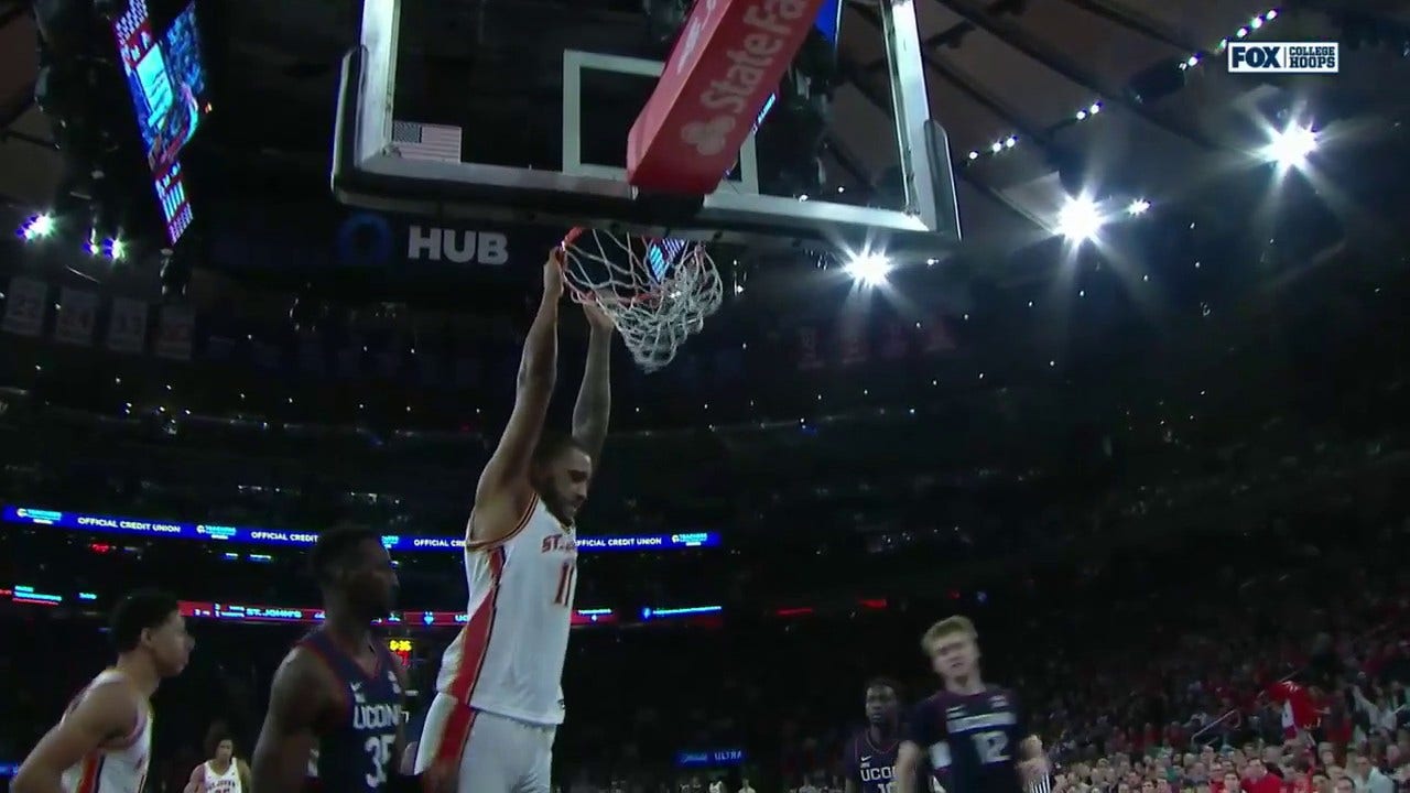 St. John's Joel Soriano flies in for the putback slam against UConn