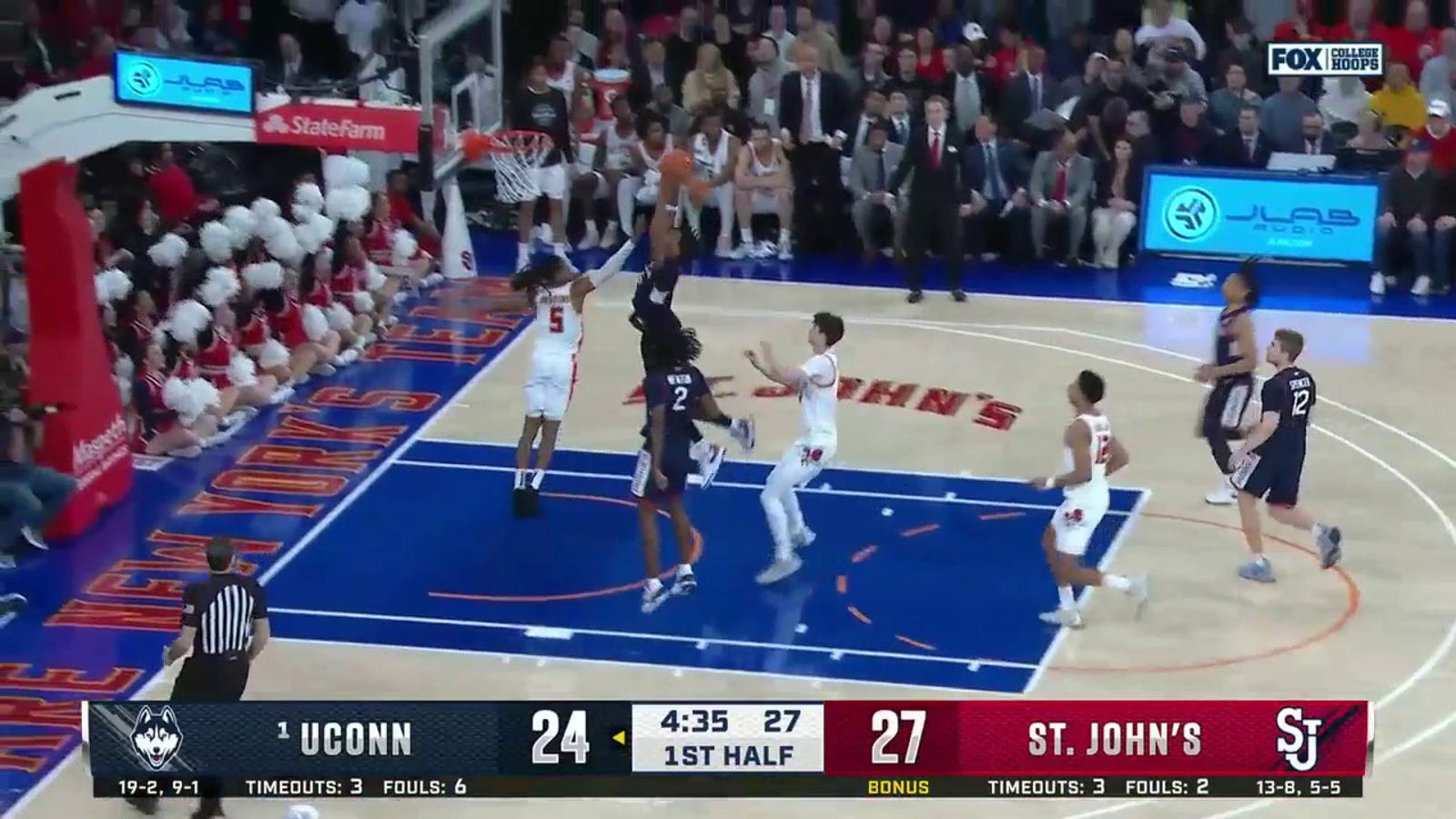 UConn's Tristen Newton spins and finds Stephon Castle for the two-handed flush in transition against St. John's