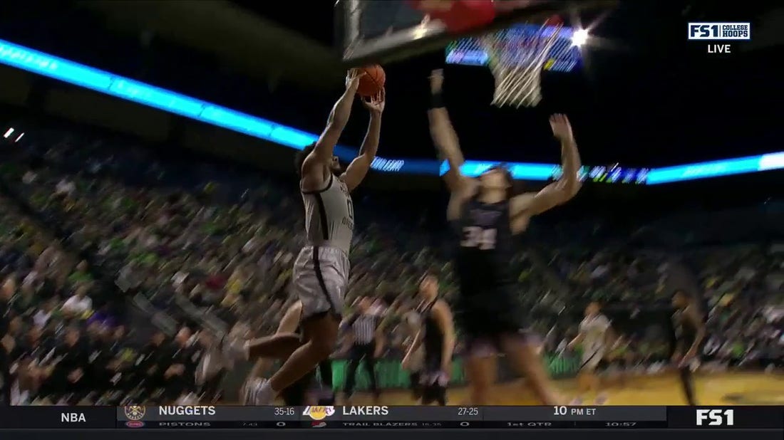 Oregon's Kario Oquendo throws down the two-handed dunk to even the score against Washington